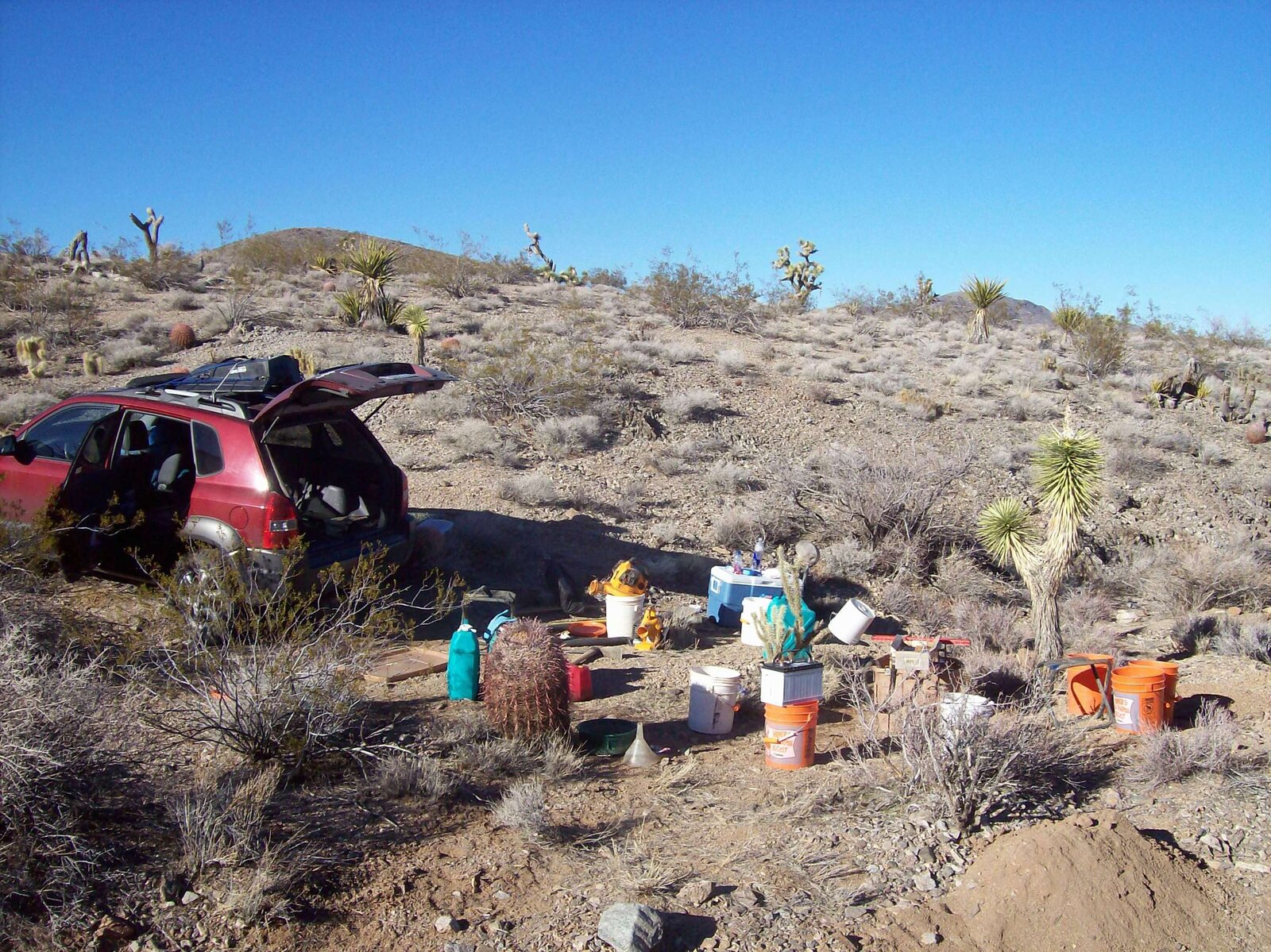 A small gold prospecting camp with buckets and a dry washer set up in White Elephant Wash in the Gold Basin area of northwestern Arizona